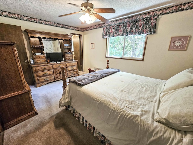 409 Garfield St, Asotin, WA 99402 - carpeted bedroom with a textured ceiling and a ceiling fan