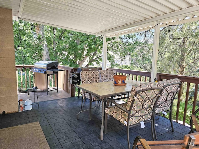 409 Garfield St, Asotin, WA 99402 - view of patio with outdoor dining area, a deck, and a grill