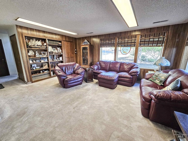 409 Garfield St, Asotin, WA 99402 - carpeted living room with wood walls and a textured ceiling