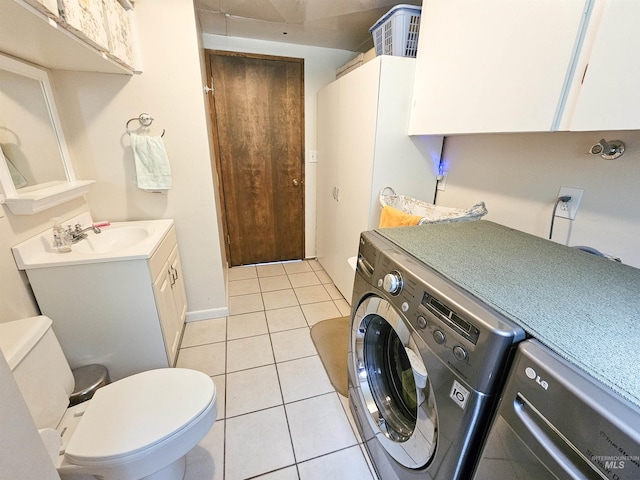 409 Garfield St, Asotin, WA 99402 - laundry area featuring washing machine and clothes dryer and light tile patterned floors