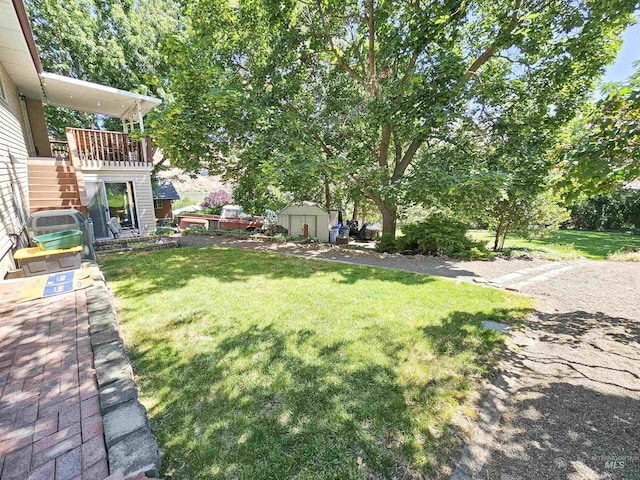 409 Garfield St, Asotin, WA 99402 - view of green lawn with a storage unit and stairway