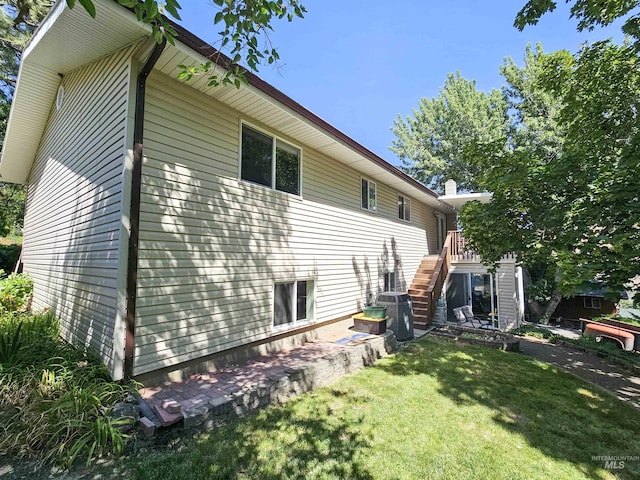 409 Garfield St, Asotin, WA 99402 - view of home's exterior featuring a yard and stairs