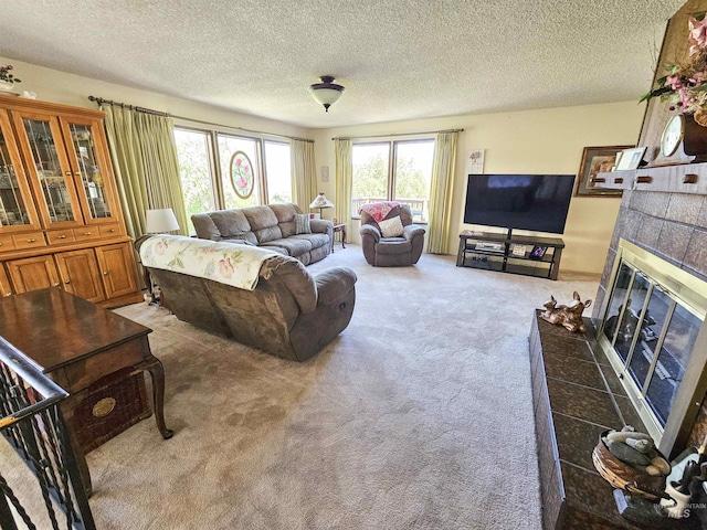 409 Garfield St, Asotin, WA 99402 - carpeted living room featuring a tiled fireplace and a textured ceiling