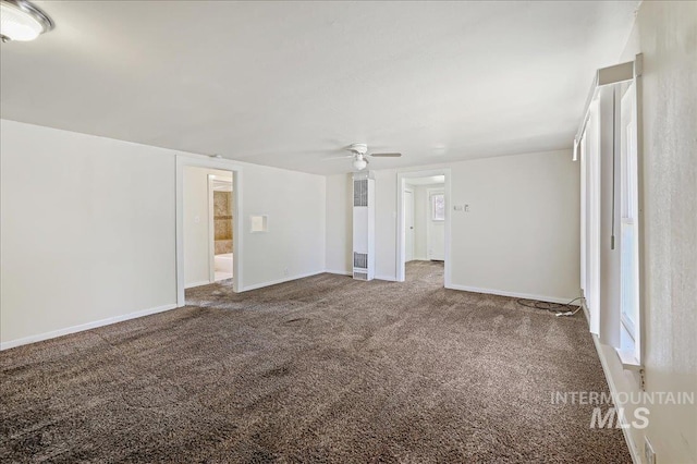 1324 E Oak St, Caldwell, ID 83605 - empty room featuring carpet floors, ceiling fan, and baseboards
