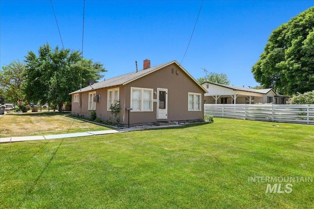 1324 E Oak St, Caldwell, ID 83605 - rear view of house featuring a chimney