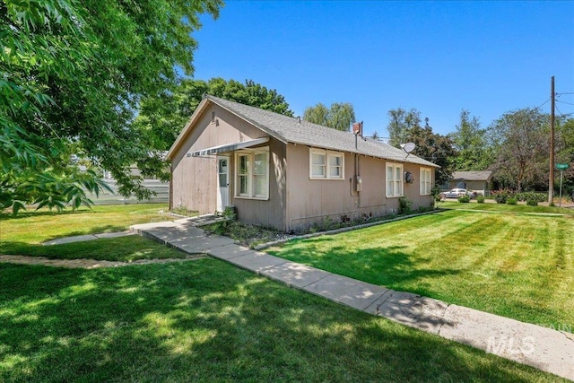 1324 E Oak St, Caldwell, ID 83605 - view of property exterior featuring a yard