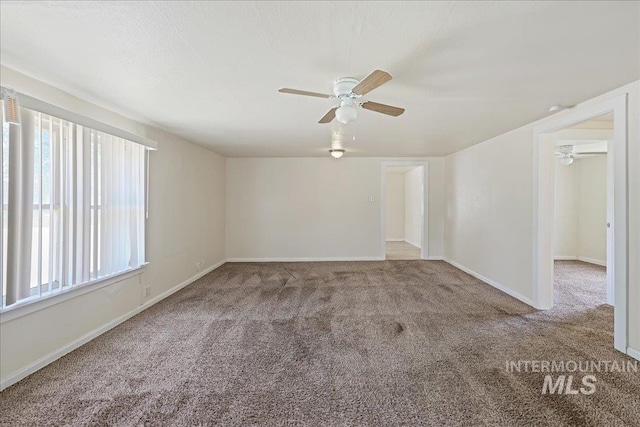 1324 E Oak St, Caldwell, ID 83605 - empty room with carpet flooring, ceiling fan, and baseboards