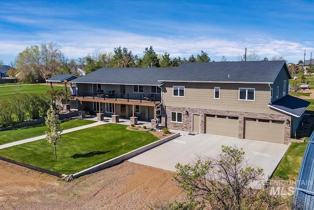 1640 S 5th W, Mountain Home, ID 83647 - view of front of property featuring an attached garage, concrete driveway, a front lawn, stone siding, and a wooden deck