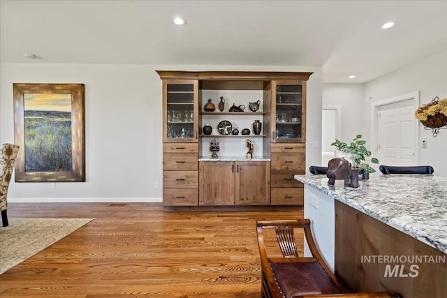 1640 S 5th W, Mountain Home, ID 83647 - bar featuring light wood-style flooring, recessed lighting, and baseboards