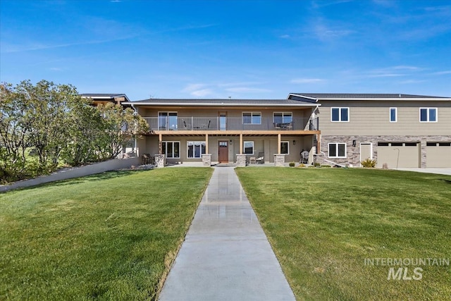 1640 S 5th W, Mountain Home, ID 83647 - view of front of home featuring a front lawn, a garage, and stone siding
