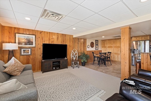1640 S 5th W, Mountain Home, ID 83647 - living area featuring light carpet, wooden walls, a paneled ceiling, and recessed lighting