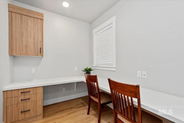 6811 W Los Flores Dr, Meridian, ID 83646 - office area with built in study area, light wood-style flooring, and baseboards