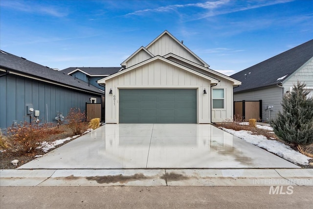 6811 W Los Flores Dr, Meridian, ID 83646 - view of front of property featuring driveway, an attached garage, and board and batten siding