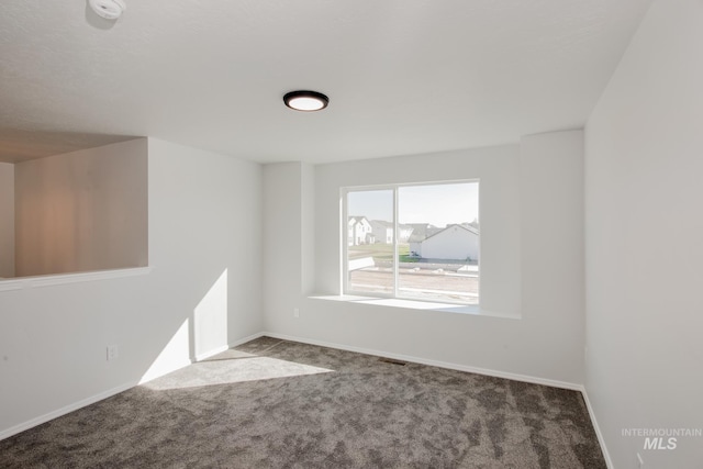 empty room featuring carpet flooring