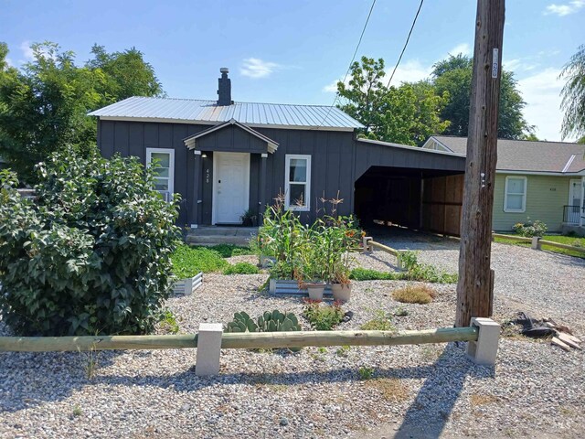 view of front of property with a carport