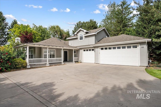 66 W Colchester Dr, Eagle, ID 83616 - traditional home featuring covered porch, an attached garage, concrete driveway, and roof with shingles