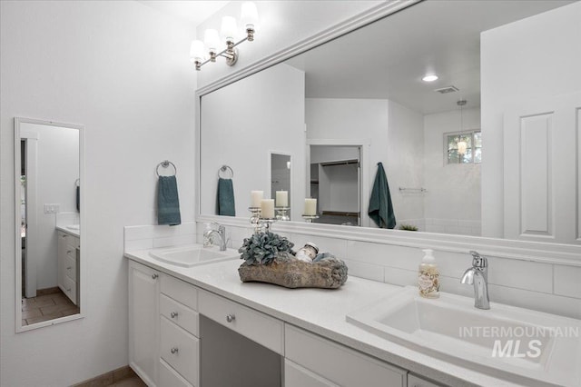 66 W Colchester Dr, Eagle, ID 83616 - full bath with double vanity and tasteful backsplash