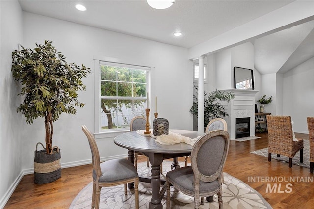 66 W Colchester Dr, Eagle, ID 83616 - dining space with wood finished floors, recessed lighting, a high end fireplace, and baseboards