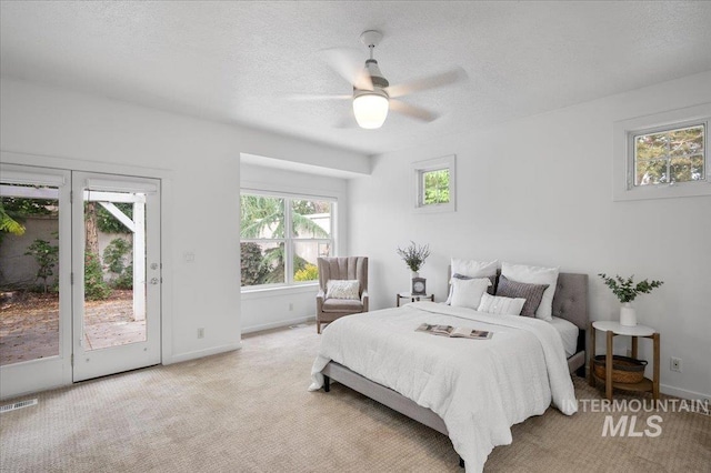 66 W Colchester Dr, Eagle, ID 83616 - bedroom featuring access to outside, carpet, baseboards, a textured ceiling, and a ceiling fan