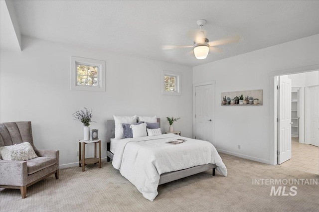 66 W Colchester Dr, Eagle, ID 83616 - bedroom featuring multiple windows, light carpet, baseboards, and a ceiling fan