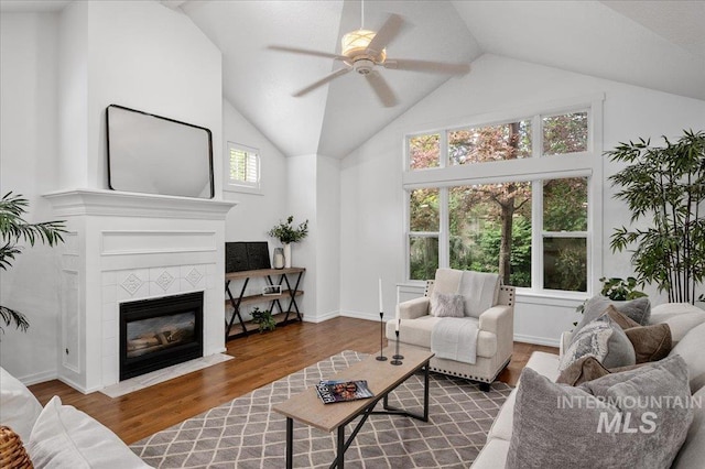 66 W Colchester Dr, Eagle, ID 83616 - living area featuring ceiling fan, wood finished floors, a fireplace, and high vaulted ceiling