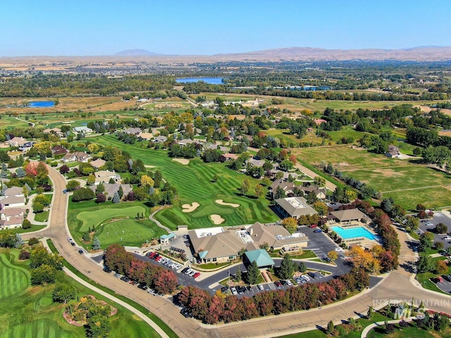 aerial view featuring view of golf course and a water view