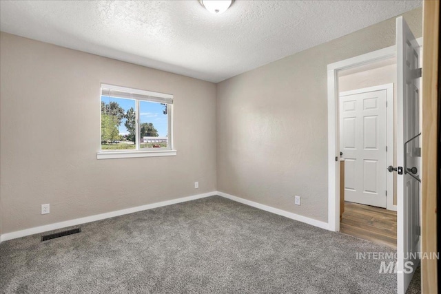 180 E Elmore, Richfield, ID 83349 - carpeted empty room with a textured ceiling and baseboards