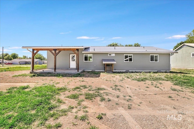 180 E Elmore, Richfield, ID 83349 - back of property with a patio area and a metal roof