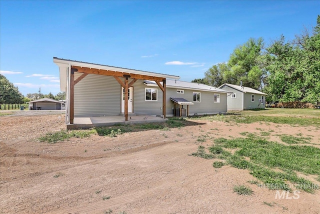180 E Elmore, Richfield, ID 83349 - rear view of house featuring a metal roof