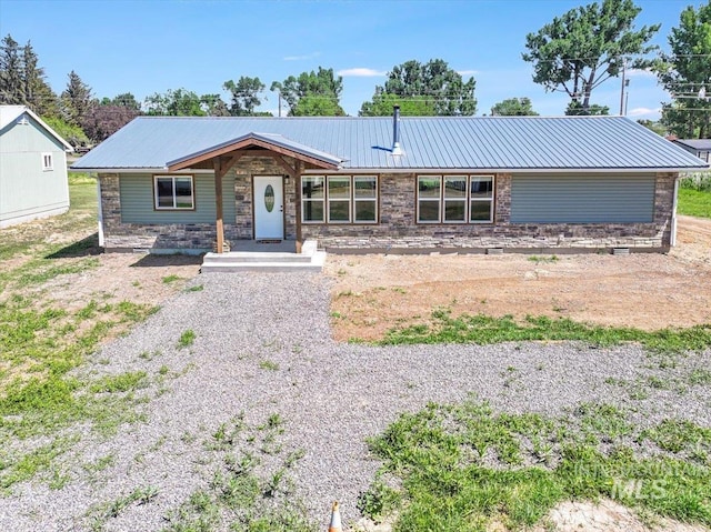 180 E Elmore, Richfield, ID 83349 - view of front facade featuring a metal roof and stone siding