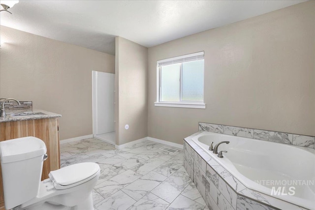 180 E Elmore, Richfield, ID 83349 - bathroom featuring marble look tiles, a garden tub, and vanity