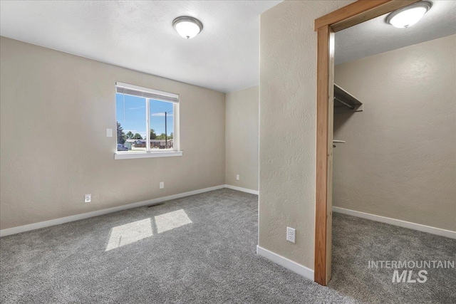 180 E Elmore, Richfield, ID 83349 - unfurnished bedroom featuring carpet flooring and a textured wall