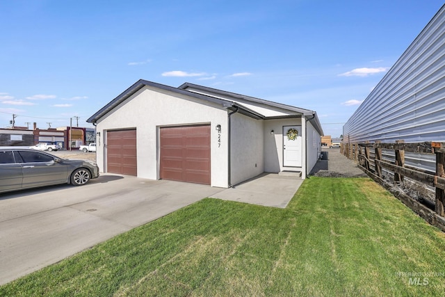247 Washington St, Gooding, ID 83330 - garage with concrete driveway