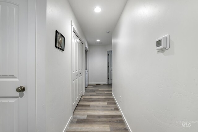 247 Washington St, Gooding, ID 83330 - hallway with recessed lighting, wood finished floors, and baseboards