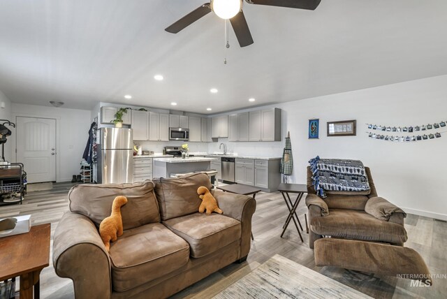 247 Washington St, Gooding, ID 83330 - living room featuring recessed lighting, a ceiling fan, baseboards, and light wood-style floors