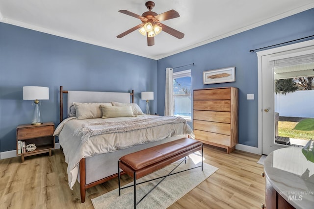 bedroom with access to outside, crown molding, light wood-style flooring, and baseboards