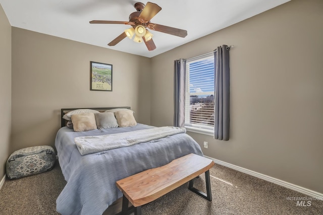 carpeted bedroom with ceiling fan and baseboards