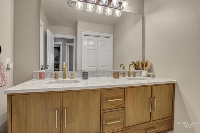 bathroom with double vanity and a sink