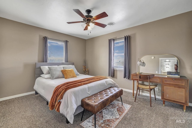 bedroom featuring light carpet, visible vents, baseboards, and a ceiling fan