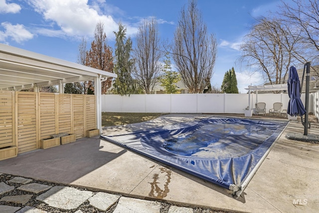 view of pool with a patio area, a fenced backyard, and a pergola