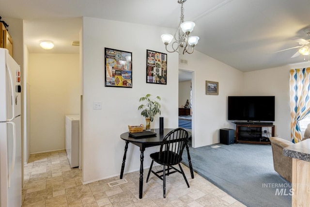 11755 E Cleft Rd, Mountain Home, ID 83647 - dining room featuring ceiling fan, washer / dryer, a chandelier, and baseboards
