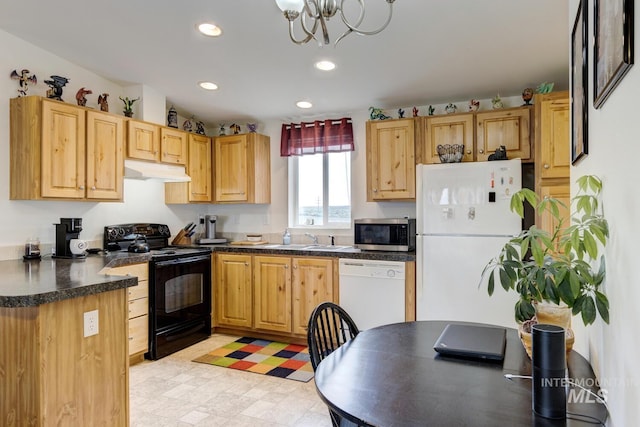 11755 E Cleft Rd, Mountain Home, ID 83647 - kitchen featuring white appliances, under cabinet range hood, dark countertops, recessed lighting, and a sink