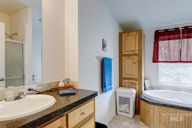 11755 E Cleft Rd, Mountain Home, ID 83647 - full bathroom featuring vanity, a bath, and a shower stall