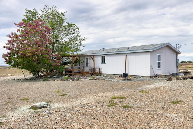 11755 E Cleft Rd, Mountain Home, ID 83647 - back of house with a wooden deck and crawl space
