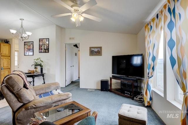 11755 E Cleft Rd, Mountain Home, ID 83647 - carpeted living room with lofted ceiling, plenty of natural light, a chandelier, and ceiling fan