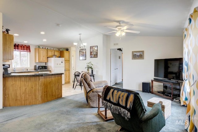 11755 E Cleft Rd, Mountain Home, ID 83647 - living area with light carpet, a chandelier, ceiling fan, recessed lighting, and lofted ceiling