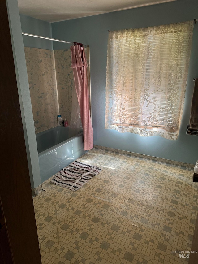 bathroom featuring shower / bath combination with curtain