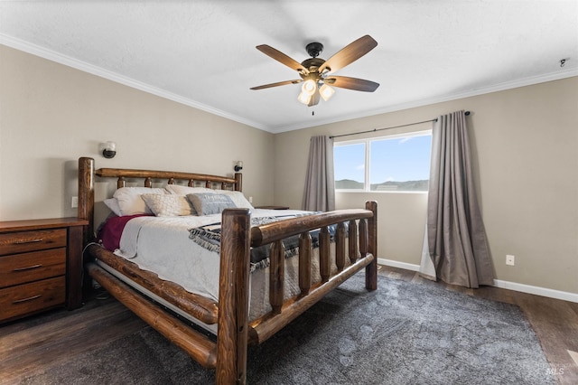 bedroom featuring dark wood finished floors, ceiling fan, baseboards, and ornamental molding