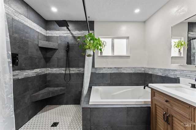 full bath with recessed lighting, a garden tub, walk in shower, and vanity