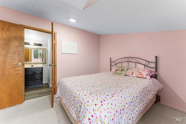 bedroom featuring carpet flooring and baseboards